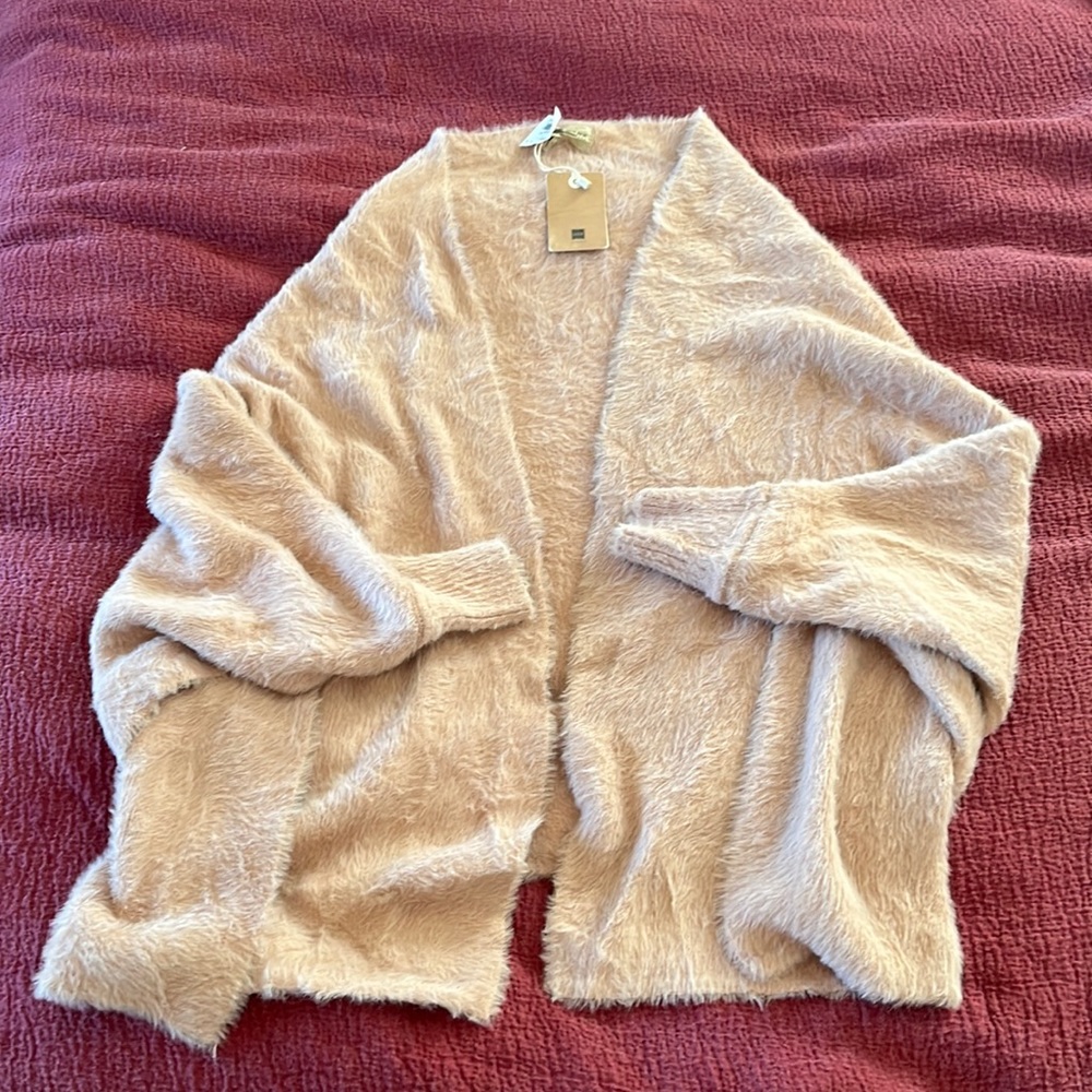 Cozy blush cardigan one size. New with tags. Very soft and cozy.